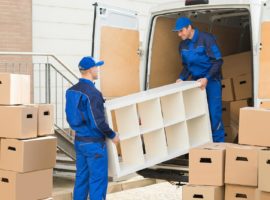Moving company loading a shelf onto a removal van