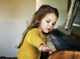 Girl playing the piano - piano removals